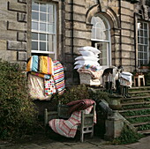 Pillows and duvets being aired on steps of old London house, UK
