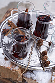 Hot drinks on silver tray with pinecones, Zermatt, Valais, Switzerland