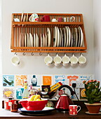 Plate rack and kettle with tiled splashback in kitchen of London home, England, UK
