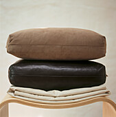 Leather and suede cushions on plywood stools