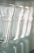 Row of tall clear glass tumblers