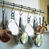 Hanging rail with stainless steel and copper pans