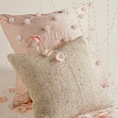 Textured pink cushions with flower petals