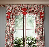 Co-ordinated curtains and pelmet at French door to balcony