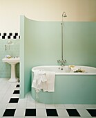 Tiled bathroom with partitioned freestanding bath