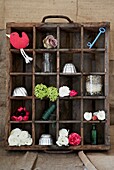 Vintage wooden crate converted to shelving solution for ornaments and trinkets