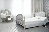 Bedroom suite in neutral white decor with deer model on dressing table symbol of gentleness and love