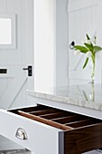Kitchen drawer open to reveal wooden interior