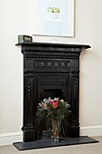 Flower arrangement in original fireplace  London  England