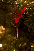 Antique key hanging from Christmas tree in London home   UK