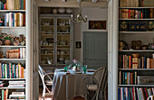 Home interior with bookshelf and dining table
