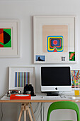 PC screen and modern art in contemporary home office,  Lewes,  East Sussex,  England,  UK