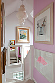 Pink staircase with artwork in Lewes home,  East Sussex,  England,  UK
