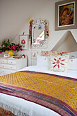 Double bed with sari fabric cover in Lewes home,  East Sussex,  England,  UK
