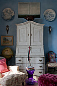 Painted writing bureau and decorative plates in Tiverton country home,  Devon,  England,  UK