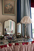 Vintage mirror and silver lamp on dressing table in Tiverton country home,  Devon,  England,  UK