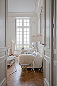 Furniture and uncurtained window of living room in Bordeaux apartment building,  Aquitaine,  France