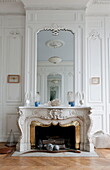 Mirror above fireplace in historic Bordeaux apartment building,  Aquitaine,  France