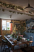 Dining table set for Christmas dinner in Benenden cottage,  Kent,  England,  UK