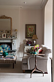 Living room details with occassional table and vase of flowers