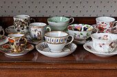 Pretty China cups and saucers on s sideboard