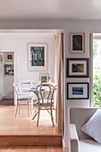Split level dining room with framed artworks in Dorset home  Kent  UK
