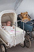 Vintage prams with toys in Dorset home  Kent  UK