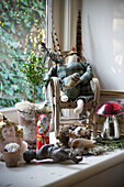 Vintage toys on windowsill in East Sussex coach house  England  UK