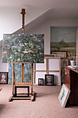 Artwork on easel in artists studio of North London Victorian house  England  UK