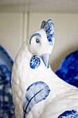 Blue and white chinaware hen on kitchen dresser in Amberley home West Sussex England UK
