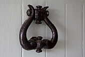 Black door knocker on front door of Petworth farmhouse West Sussex Kent
