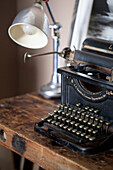 Industrial typewriter on old toolmaker?s bench in Edwardian West Sussex townhouse England UK