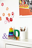 Childs toys  letter 'D' and ampersand with star decorations in London family home  England  UK