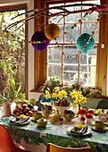 Easter eggs and hot cross buns on kitchen table in London home   England   UK