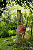 Planted fire bucket in Brabourne garden,  Kent,  UK