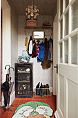 Coats and shoes in entrance of Faversham family home,  Kent,  UK