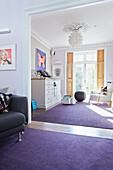 Sunlit double living room in London family townhouse  England  UK