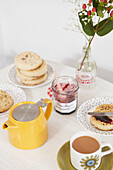 Crumpets and jam with yellow teapot and tea in Alloa kitchen  Scotland  UK