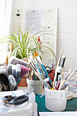 Assorted paintbrushes on workbench in Alloa studio  Scotland  UK