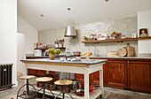 Farmhouse kitchen with salvaged island unit in London home  UK
