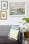 Houseplant and artwork with black leather sofa in Sheffield home  Yorkshire  UK