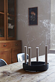 Snuffed candles with smoke on wooden dining table in Sheffield home  Yorkshire  UK