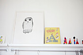 Framed owl and toys on shelf in child's room of Sheffield home  Yorkshire  UK