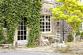 Overgrown doorway on stone exterior of West Yorkshire home  UK