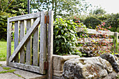 Open gate in garden of Berwick Upon Tweed home  Northumberland  UK