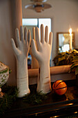 Hand ornaments with scented orange on mantlepiece in Rochester home  Kent  UK
