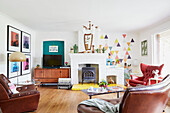 Leather armchairs and vintage sideboard in living room  East Riding of Yorkshire  England  UK