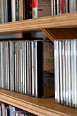 CD collection on shelving in watermill conversion