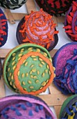 Detail of brightly coloured felt hats