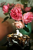Still life of roses with antique decorative box